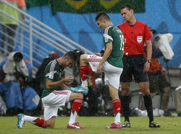 Mexico striker Peralta celebrates with teammate Layun after scoring the winner against Cameroon in their FIFA World Cup Group A match, 13 June Peralta Mexico Layun