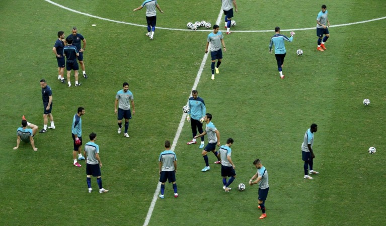 Portugal's team members are pictured during a training session at the Arena Fonte Nova stadium ahead of their 2014 World Cup against Germany in Salvador Portugal