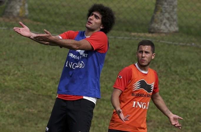 Belgium players Marouane Fellaini and Eden Hazard react during a training session Eden Hazard Marouane Fellaini Belgium