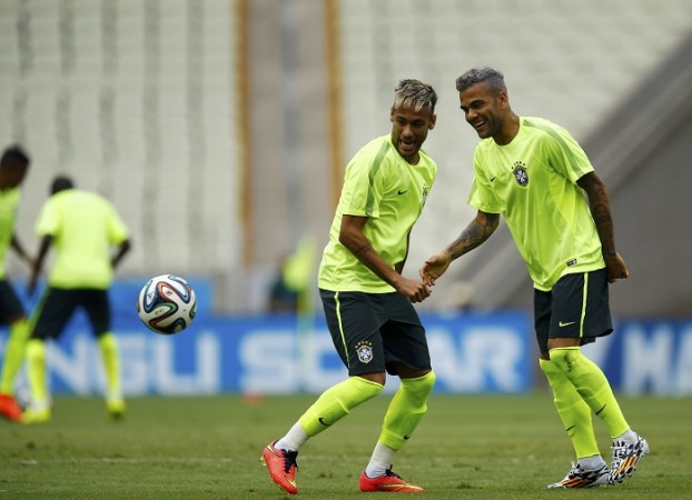 Brazil players Neymar and Dani Alves share a laugh during a training session, 16 June Neymar Dani Alves Brazil