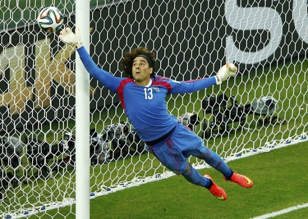 Mexico goalkeeper Guillermo Ochoa makes a stunning save to deny Brazil forward Neymar a goal, 17 June Guillermo Ochoa Mexico