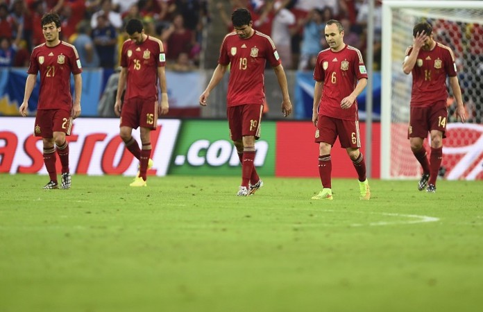 Spain players react after conceding a second goal to Chile, 18 June Spain