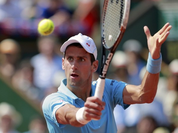 Novak Djokovic of Serbia returns the ball to Rafael Nadal. Novak Djokovic