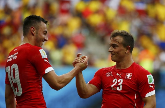 Switzerland playmaker Xherdan Shaqiri (R) celebrates with teammate Josip Drmic after scoring against Honduras, 25 June Xherdan Shaqiri Josip Drmic Switzerland