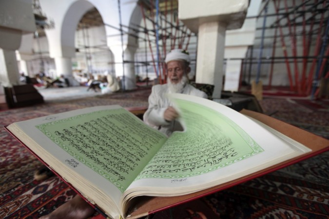 A man reading Koran