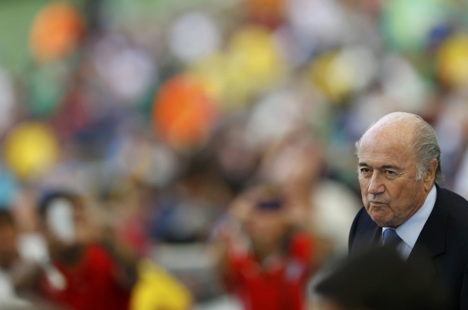 Fifa president Sepp Blatter takes his seat before the 2014 World Cup Group H soccer match between Belgium and Russia at the Maracana stadium in Rio de Janeiro.