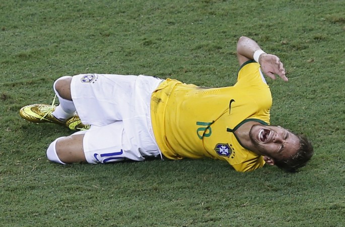 Brazil's Neymar screams in pain after being fouled by Colombia's Zuniga during their 2014 World Cup quarter-finals at the Castelao arena in Fortaleza Brazil striker Neymar