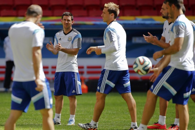 Argentina's Lionel Messi applauds during a team training session at the national stadium in Brasilia Argentina, Lionel Messi