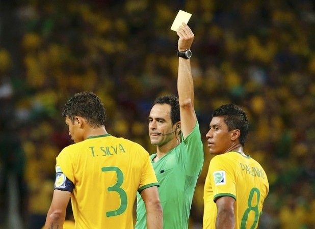 Brazil's Thiago Silva is shown the yellow card during the quarterfinals clash between Brazil and Colombia. Thiago Silva