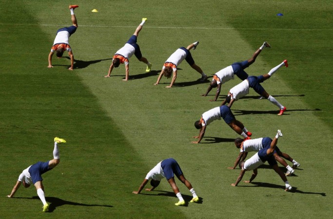 Netherlands' national soccer team players warm up during a training session ahead of their third place play offl match against Brazil at the Brasilia National stadium in Brasilia Netherlands