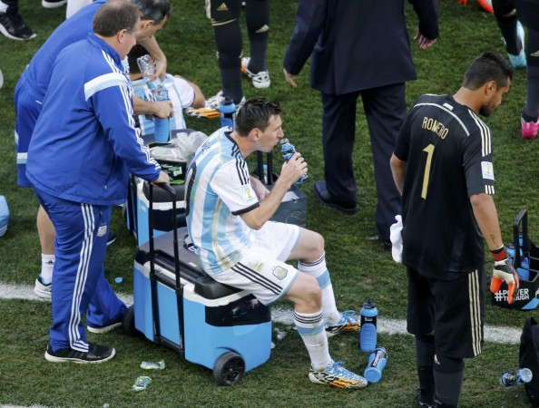 Argentina captain, Lionel Messi taking an "energy drink", hoping to beat fatigue before the extra time of Argentina's Round of 16 match in the FIFA World Cup, 2014, at the Corinthians Arena, in Sao Paolo.