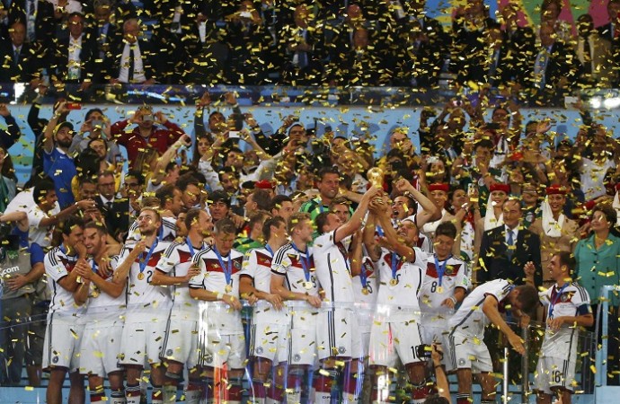 Germany players celebrate with the World Cup trophy as confetti pours down Germany World Cup final