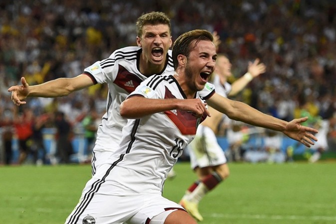 Germany's Mario Goetze celebrates his goal against Argentina infront of teammate Thomas Mueller. Mario Goetze and Thomas Mueller
