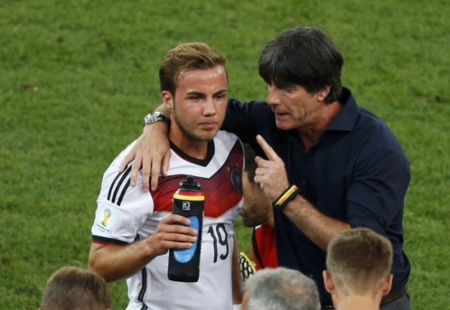 Germany's coach Joachim Loew talks to Mario Goetze before extra time. Joachim Loew talks to Mario Goetze