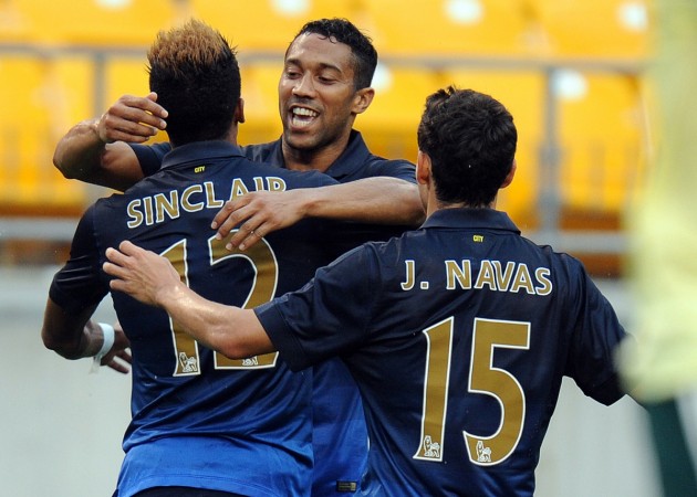 Scott Sinclair celebrates with Gael Clichy and Jesus Navas after scoring Manchester City's second goal against AC Milan Manchester City vs AC Milan