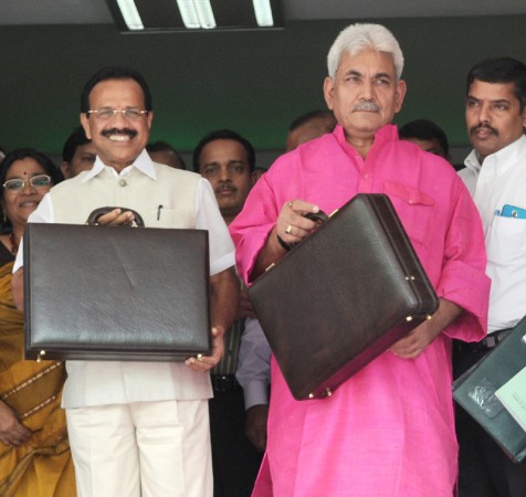 Union Minister of State for Railways Manoj Sinha (Right) with Railways Minister Sadananda Gowda before presenting the Rail Budget 2014-15 in New Delhi on 8 July, 2014. Manoj Sinha, Sadanada