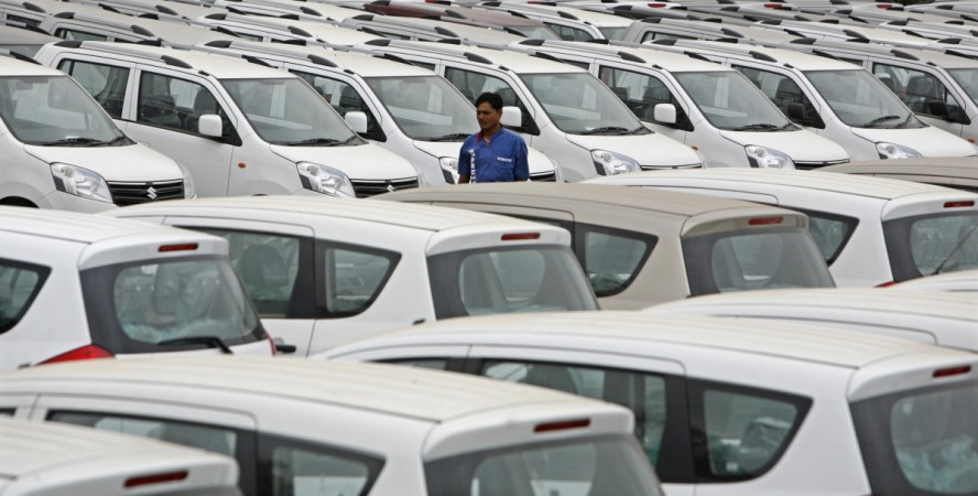 A worker walks at a Maruti Suzuki stockyard on the outskirts of the western Indian city of Ahmedabad July 28, 2012. Maruti Suzuki, India's biggest carmaker, lagged estimates with a 23 percent fall in fiscal first-quarter profit, its fourth consecutive qua