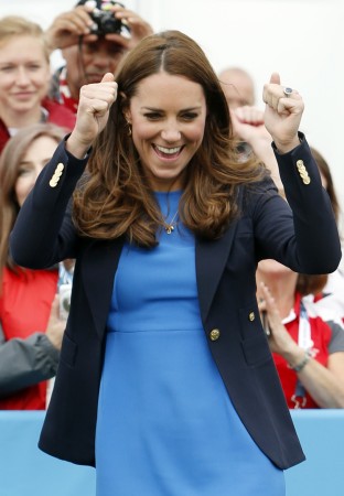 Britain's Catherine, Duchess of Cambridge reacts as she plays South African games 'Three Tins' during a visit to the Commonwealth Games Village at the 2014 Commonwealth Games in Glasgow, Scotland July 29, 2014 Kate Middleton