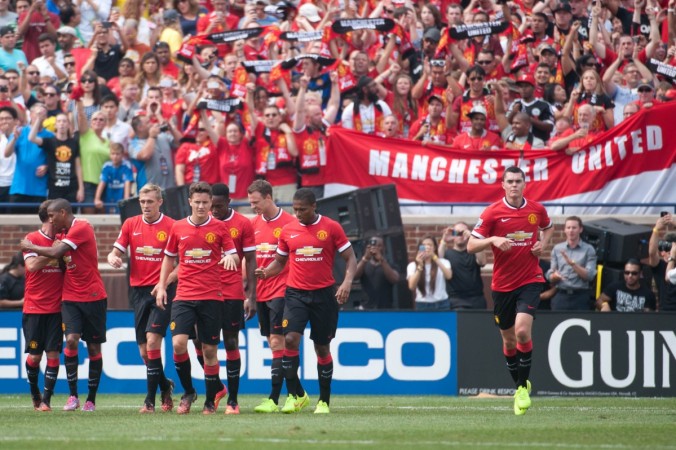 Manchester United players celebrate the goal of midfielder Ashley Young (18) during the first half against Real Madrid at Michigan Stadium Manchester United vs Real Madrid