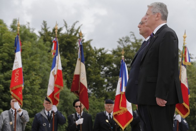 French President Francois Hollande and German President Joachim Gauck (R) attend a ceremony to commemorate the centenary of the start of World War One (WWI) at the Vieil Armand French President Francois Hollande and German President Joachim Gauck (R) attend a ceremony to commemorate the centenary of the start of World War One (WWI) at the Vieil Armand