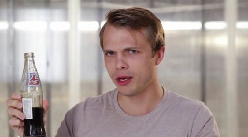 An American taste tester trying Thums Up. Indian snacks