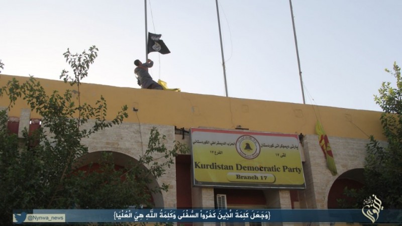 ISIS militant hoists flag in Sinjar