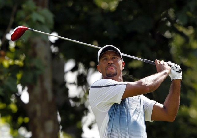 Tiger Woods watches his tee shot during practice for the US PGA Championship at Valhalla Golf Club. Tiger Woods