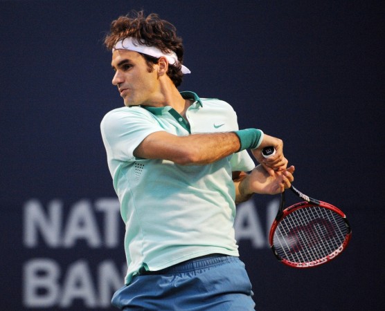 Roger Federer returns a shot against Feliciano Lopez. Roger Federer