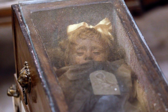 Fully clothed human remains of Rosalia Lombardo, two-years old, representing some of the world's best-preserved bodies, are displayed at the Capuchin Catacombs in Palermo, southern Italy, January 31, 2011. Fully clothed human remains of Rosalia Lombardo, two-years old, representing some of the world's best-preserved bodies, are displayed at the Capuchin Catacombs in Palermo, southern Italy, January 31, 2011.