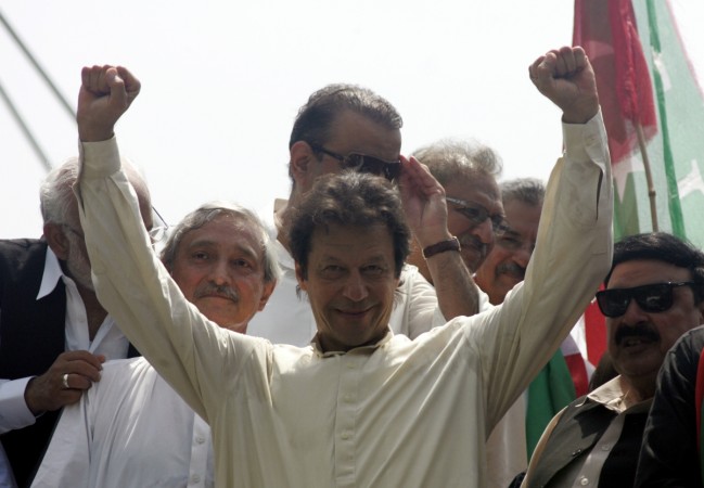 Imran Khan, chairman of Pakistan Tehreek-e-Insaf (PTI) political party, gestures as he leads the Freedom March in Lahore August 14, 2014. Imran Khan