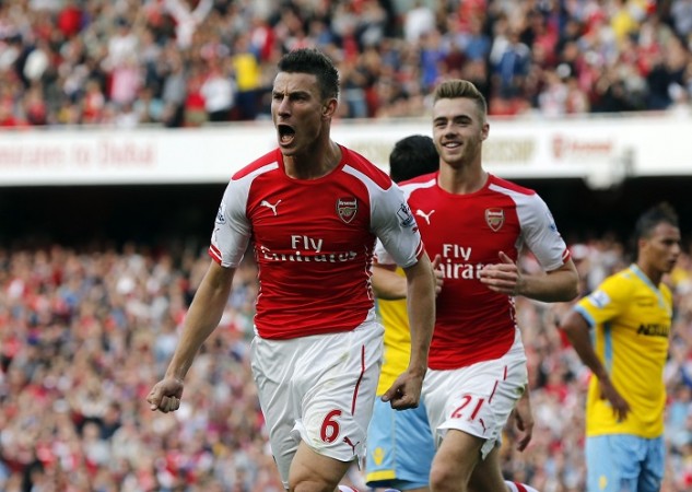 Arsenal defender Laurent Koscielny celebrates after scoring the equaliser against Crystal Palace in the English Premier League Laurent Koscielny Calum Chambers Arsenal