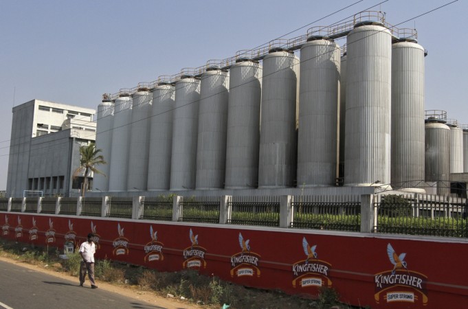 A man walks outside the factory of United Breweries Ltd (UB) that manufactures Kingfisher beer in Thiruvalluar district of the southern Indian state of Tamil Nadu March 30, 2012. united breweries, ub group, vijay mallya's arrest, ub share price, usl share price, diageo