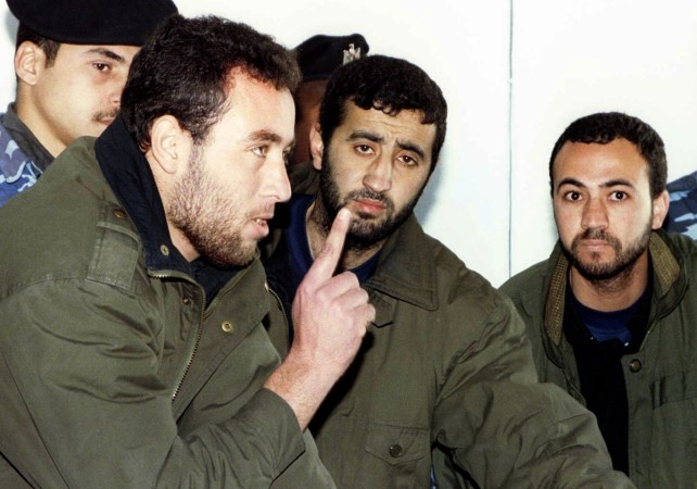 (L-R) Raed al-Attar, Mohammed Abu Shammala and Osama Abu Atah from Hamas, stand before a Palestinian Authority court in Gaza in this February 27, 1999 file photo. (L-R) Raed al-Attar, Mohammed Abu Shammala and Osama Abu Atah from Hamas, stand before a Palestinian Authority court in Gaza in this February 27, 1999 file photo.