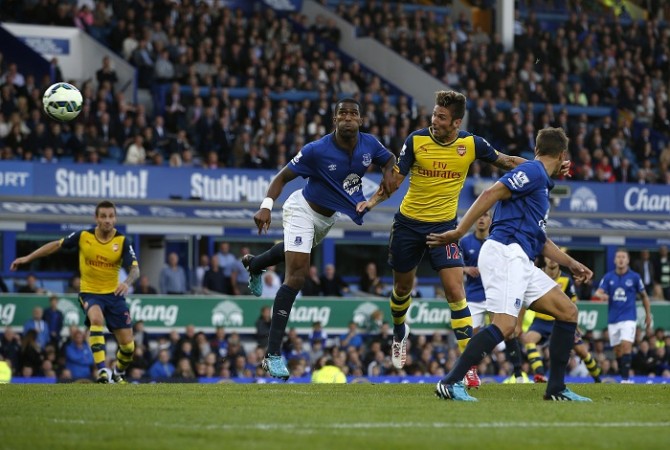 Arsenal striker Olivier Giroud heads home the winner in the English Premier League game against Everton Olivier Giroud Arsenal Sylvain Distin Everton