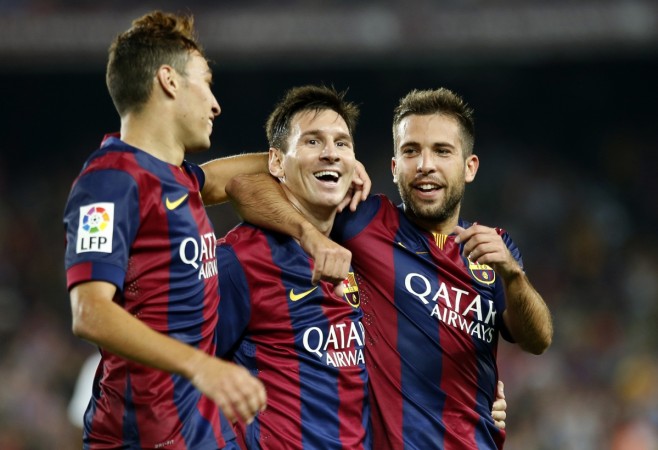 Barcelona's Lionel Messi (C) celebrates his second goal with teammate Munir El Haddadi (L) and Jordi Alba during their Spanish first division soccer match against Elche at Nou Camp stadium in Barcelona Barcelona vs Elche