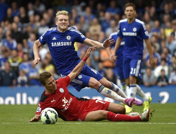 Chelsea's Andre Schurrle (R) is fouled by Leicester City's Dean Hammond during their English Premier League match at Stamford Bridge Chelsea