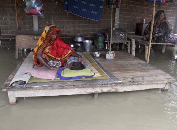 Villagers in their half flooded house in Morigaon district. Assam Flood