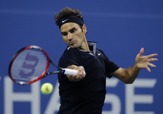 Roger Federer returns to Marinko Matosevic during their first round match at the 2014 US Open. Roger Federer