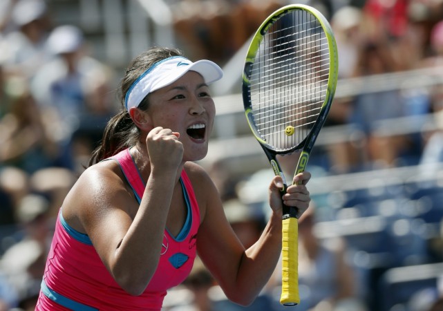 Peng Shuai of China celebrates after defeating Agnieszka Radwanska of Poland during their match at the 2014 US Open. Peng Shuai