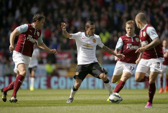 Manchester United's Angel Di Maria (2nd L) is challenged by Burnley's Kieran Trippier (R) and Scott Arfield (2nd R) during their English Premier League match at Turf Moor Angel Di Maria