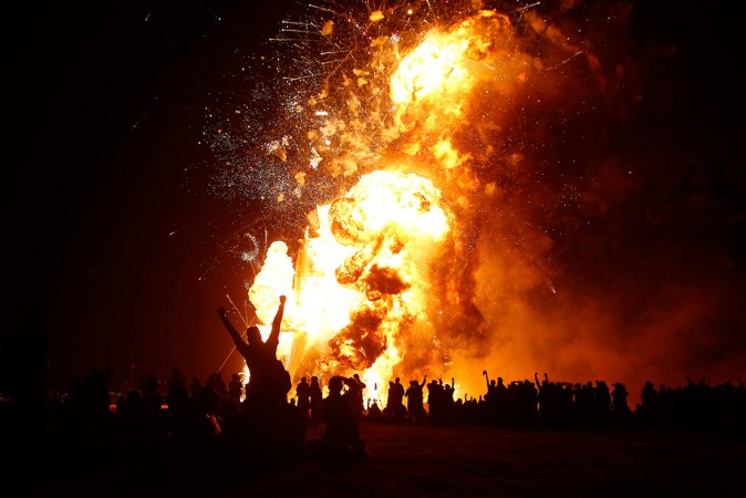 Participants broke out in loud cheer seeing the effigy of The Man burn Participants broke out in loud cheer seeing the effigy of The Man burn