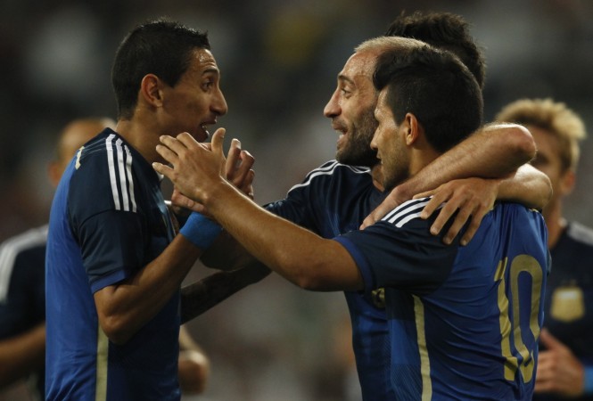 Argentina's Angel Di Maria, Pablo Zabaleta and Sergio Aguero (L-R) celebrate after Aguero scored a goal against Germany during their friendly match in Duesseldorf Argentina