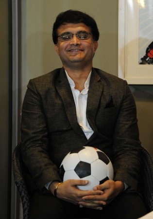 Former cricketer Saurav Ganguly poses with a fooball during a press conference of Indian Super League in Kolkata Saurav Ganguly