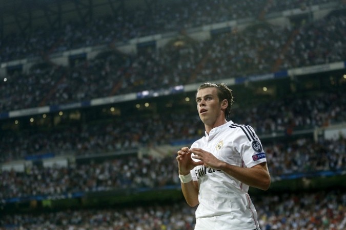 Real Madrid forward Gareth Bale celebrates after scoring against Basel in the Champions League Real Madrid Gareth Bale
