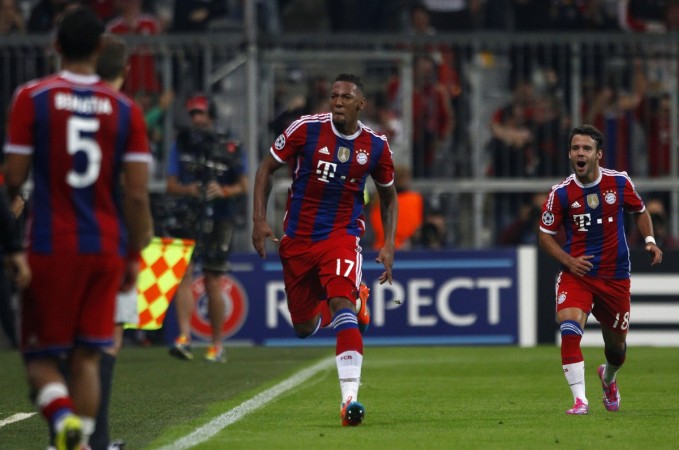 Bayern Munich's Jerome Boateng celebrates with his team mate Juan Bernat (R) after scoring a goal against Manchester City during their Champions League group E match in Munich Bayern Munich vs Manchester City