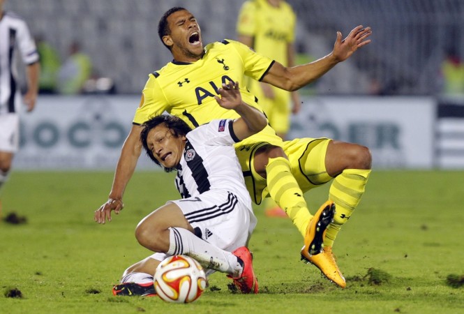 Tottenham Hotspur's Nabil Bentaleb (top) is challenged by Partizan Belgrade's Predrag Luka during their Europa League Group C match in Belgrade Tottenham