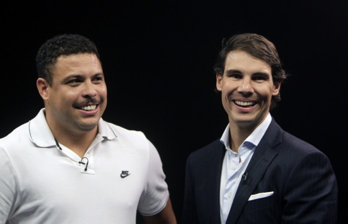 Spanish tennis player Rafael Nadal (R) and former Brazilian soccer player Ronaldo smile as they arrive at a celebrity poker tournament, the European Poker Tour Charity Challenge, in Prague December 12, 2013. Rafael Nadal