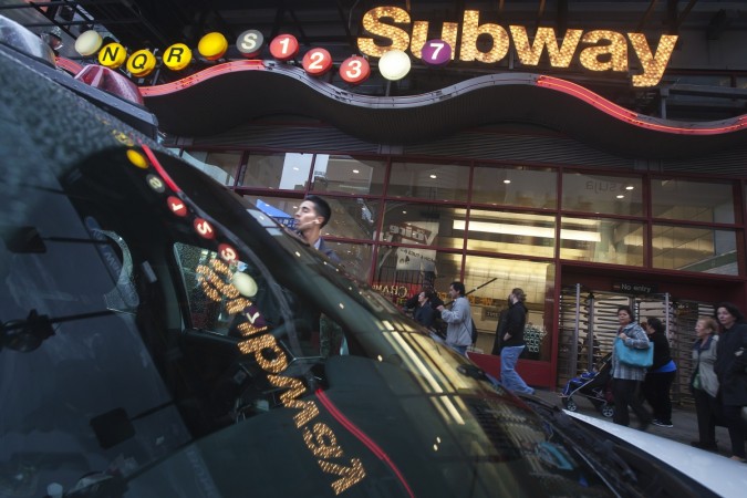 The Times Square subway station is reflected in the front window of a police car in the Manhattan borough of New York on 25 September 2014. Iraq claimed to have The Times Square subway station