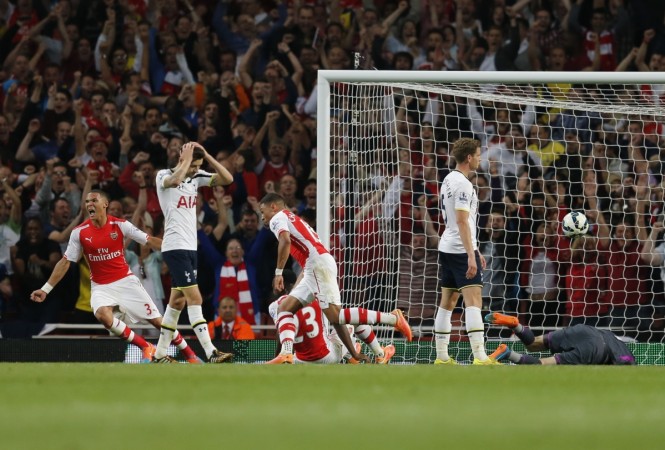 Arsenal's Alex Oxlade Chamberlain (2nd R) celebrates after scoring a goal during their English Premier League match against Tottenham Hotspur at the Emirates stadium in London Arsenal vs Tottenham