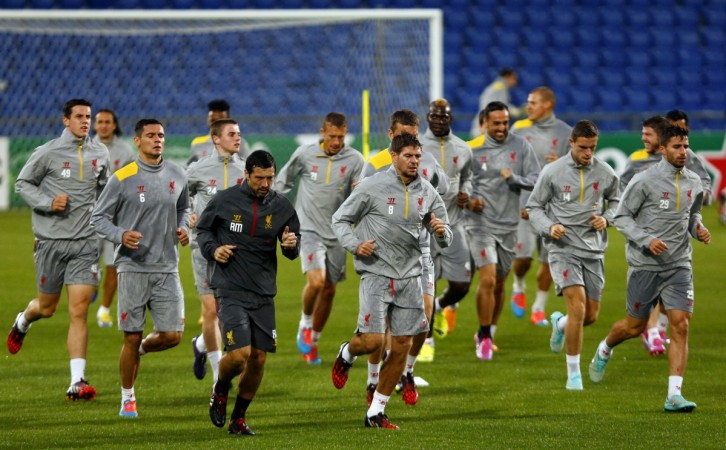 Liverpool's players run during a training session ahead of their Champions League Group B match at FC Basel Liverpool